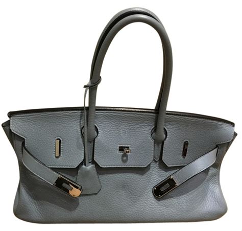 A birkin bag has a simple rectangular shape. Hermès JPG Birkin 2009 42cm Blue Leather Shoulder Bag - Tradesy
