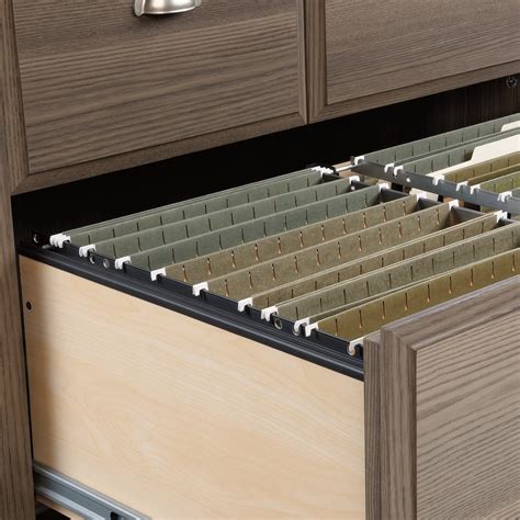 Lower drawer features full extension slides and holds letter, legal, or european size hanging files; Sauder Shoal Creek Lateral File Cabinet with Doors ...