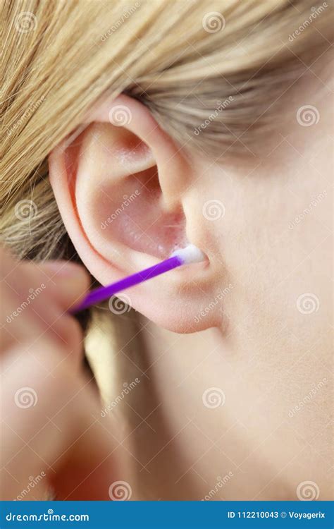 Woman Cleaning Ear With Cotton Swabs Closeup Stock Image Image Of