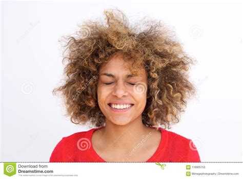 Close Up Embarrassed Young Woman Smiling With Eyes Closed Stock Image
