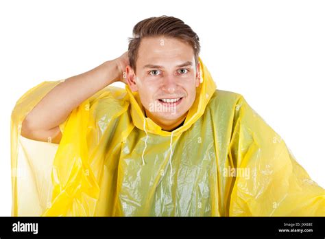 Picture Of A Caucasian Young Man Wearing A Yellow Raincoat Posing On