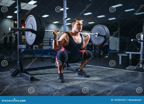 Powerlifter Doing Weightlifting Exercise Man With Naked Torso Lifting Weights Stock Photography