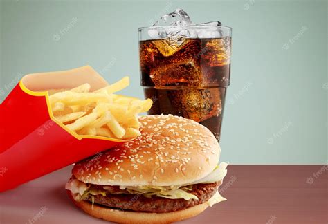 Premium Photo Tasty Fresh Burger Fries And Coke On The Wood Table