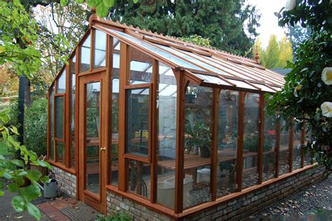 Inside the greenhouse, tropical plants grow during the winter while vegetables and flowers get started for spring. Greenhouse gardening in a Garden Deluxe Greenhouse