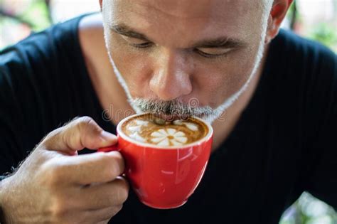 Mature Man Freelancer Drinking Coffee From Red Cup Stock Image Image