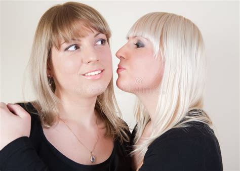Brunett And Blond Girl Kissing In The Cheeck Stock Image Image Of Female Face 13142419