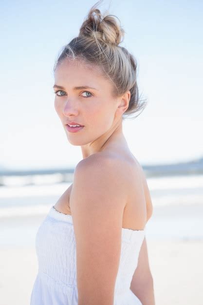 premium photo pretty blonde on the beach looking at camera