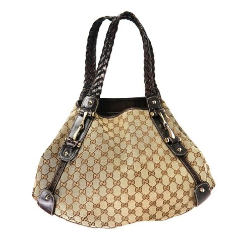 Part of gucci's cruise 2020 collection, this horsebit 1955 bag features gucci's signature monogram against a beige supreme canvas. Gucci Horsebit Pelham Braided Gg Logo Leather Tan - Brown ...
