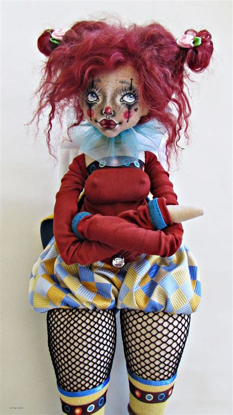 A Creepy Doll With Red Hair And Makeup