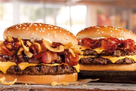 These are topped with three half slices of bacon, two slices of american cheese, and garlic pieces. Burger King Introduces New Steakhouse King | Brand Eating