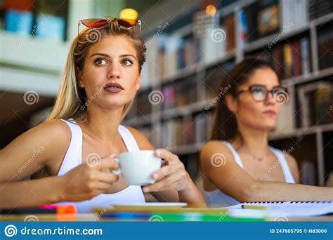 Group Of Happy College Students Studying In The School Library