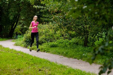 Young Woman Jogging In The Park Stock Image Image Of Rate Park 79122761