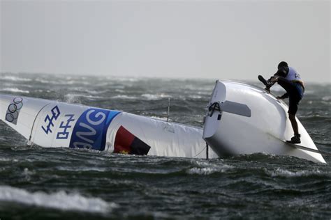 Foul Weather Hits Olympics On The Track And At Sailing Sports