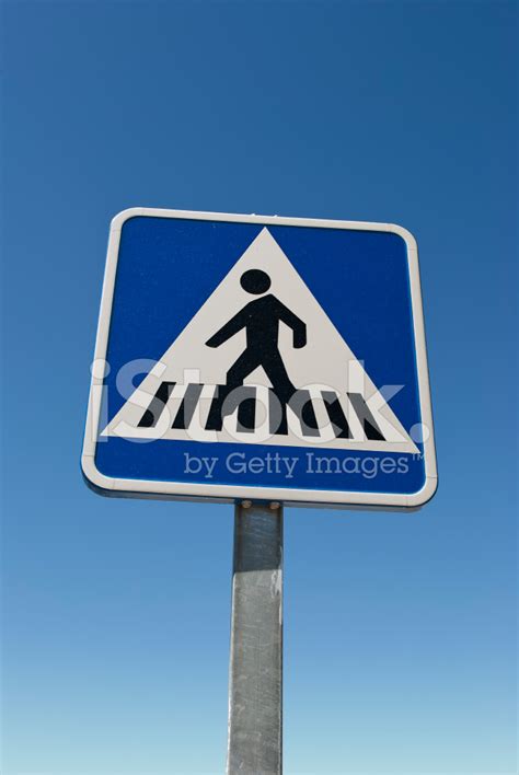 Crossing Sign Blue Crosswalk Sign Isolated On Blue Stock Photo