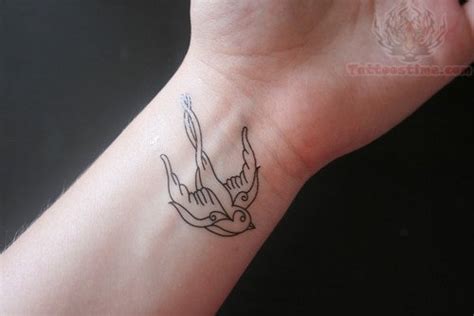 Flying Small Swallow Tattoo On Wrist