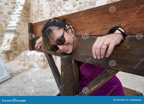 Cheerful Woman In A Pillory Posing For The Camera Stock Image Image