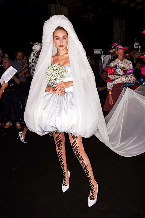 Gigi Hadid Wearing A Strapless Satin Bridal Dress By Moschino Ss19 Gigi