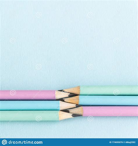 Pastel Colored Pencils On Empty Sheet Blue Toned Stock Photo Image