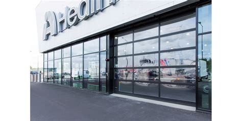 Laurent overhead door systems status: Fully-glazed overhead sectional door from ASSA ABLOY ...