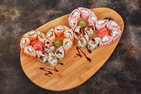 Japanese Food Sushi Maki Rolls On Wooden Board Heart Shape Stock Image
