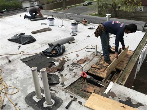 commercial flat roof leak repair specialist company near me local roofers