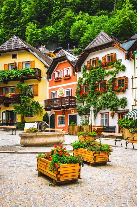 Typical Austrian Houses Standing On The Mountain Hillside In Alp Stock