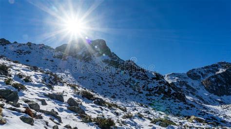 Peak Of The Achisho Mountain Covered By Snow And Sun Flares Winter In