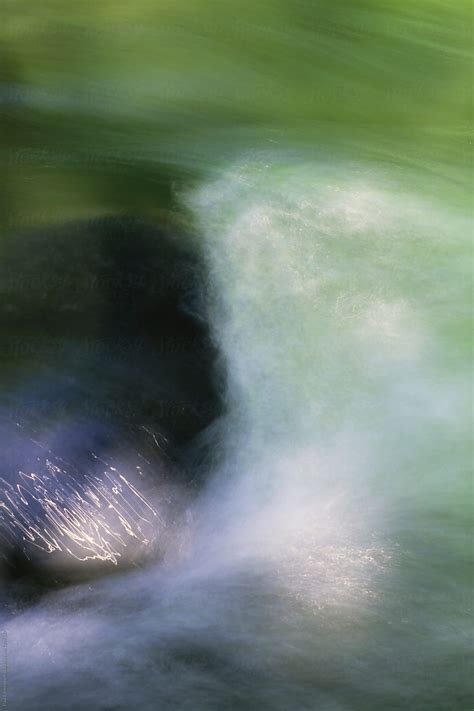 Abstract Of Stream Water Flowing Over Boulder Long Exposure By