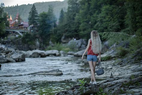 Girl At The River In The Carpathian Mountains