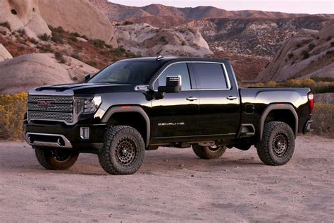 A Black Truck Is Parked In The Desert