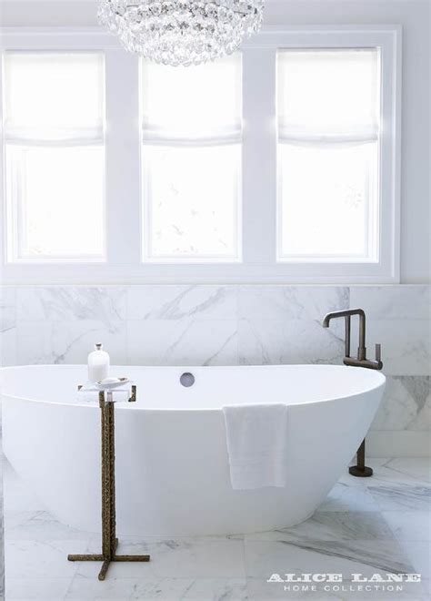 Jaquar presents an amazing collection of bath tubs filler tap. Oval Bathtub with Angled Matte Black Tub Filler ...