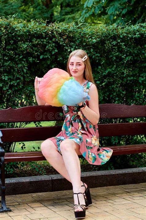 Happy Joyful Beautiful Young Woman With Candy Floss In The Park At