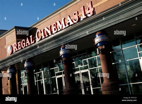 A Logo Sign Outside Of A Regal Cinemas Movie Theater Location In