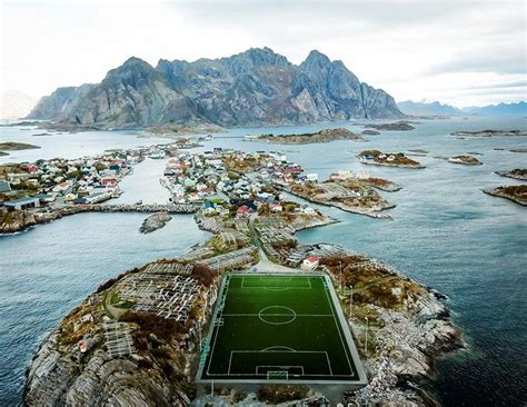 The henningsvær idrettslag stadion in the small fishing village of henningsvær, located on two small islands off lofoten, in norway, can hardly be called a stadium; Lofoten, Norway, Football field