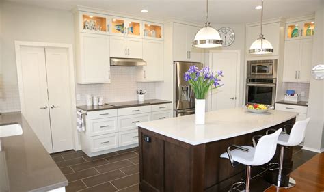 Cabinetry in traditional kitchens was often framed or flush inset. Cedar Park Transitional White Kitchen with Espresso Island ...