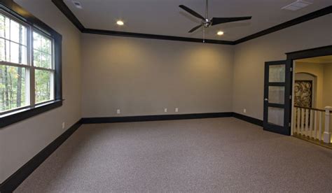She decided to buy then install crown molding in her bedroom herself rather than hiring out the job. Game room with carpet and dark wood crown molding ...
