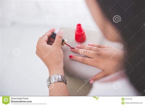 woman applying nail polish into her nail stock image image of manicure accessory 61151705