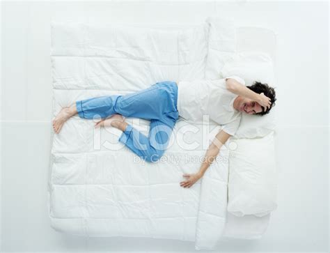 Top View Of Man Lying On Bed Stock Photos