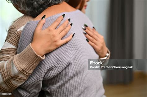 Close Up Image Adult Daughter Hugging Middle Aged Mother Enjoying