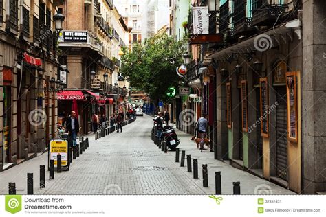 Old Narrow Street With Few Cafe In Madrid Editorial Photo