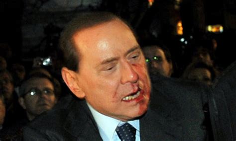 In spite of a conviction for tax fraud and a ban on him holding public office. Silvio Berlusconi hit in the face | World news | The Guardian
