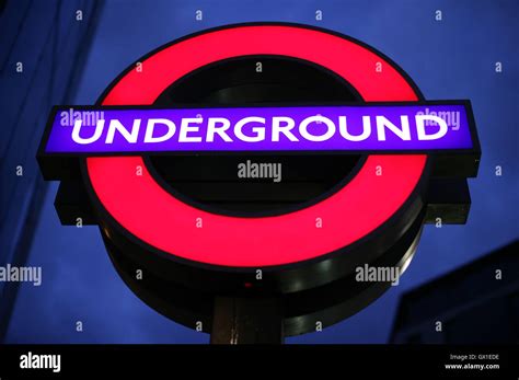 A London Underground Sign Against The Night Sky Outside St Pauls