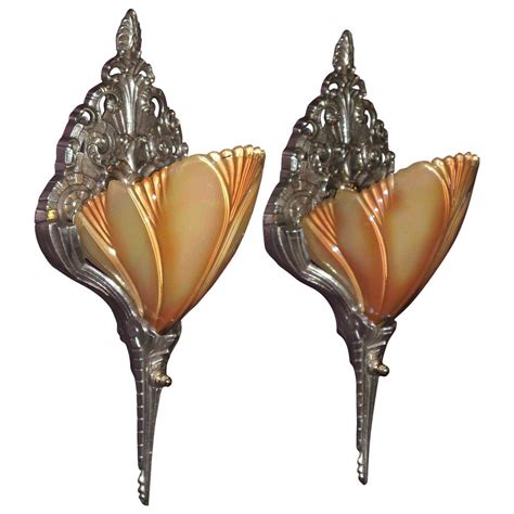 The light is usually, but not always, directed upwards and outwards, rather than down. Art Deco Slip Shade Wall Sconces, 1920s-1930s at 1stdibs