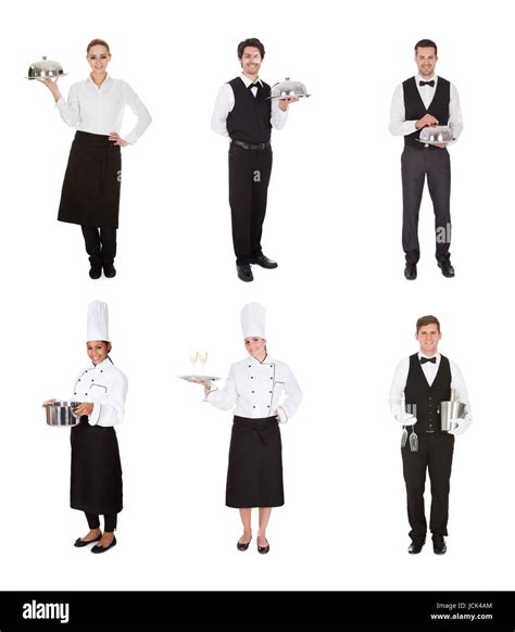 Young Group Of Waiters And Waitress Over White Background Stock Photo