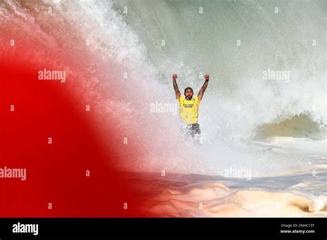 Billy Kemper Throws Up His Arms Up After Completing His Ride In Hawaii
