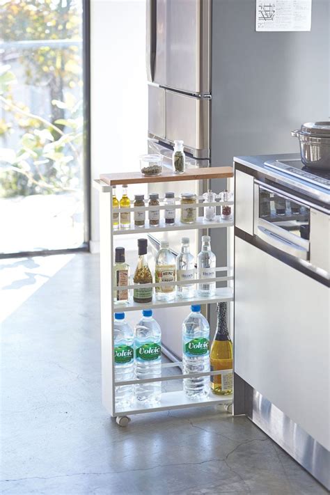 Perfect for the kitchen, this storage cart fits into that unused space between appliances and cabinets, and is just as handy in the laundry room, bathroom, bedroom, garage or any room. Fully stocked Yamazaki Rolling Slim Storage Cart, pulled ...