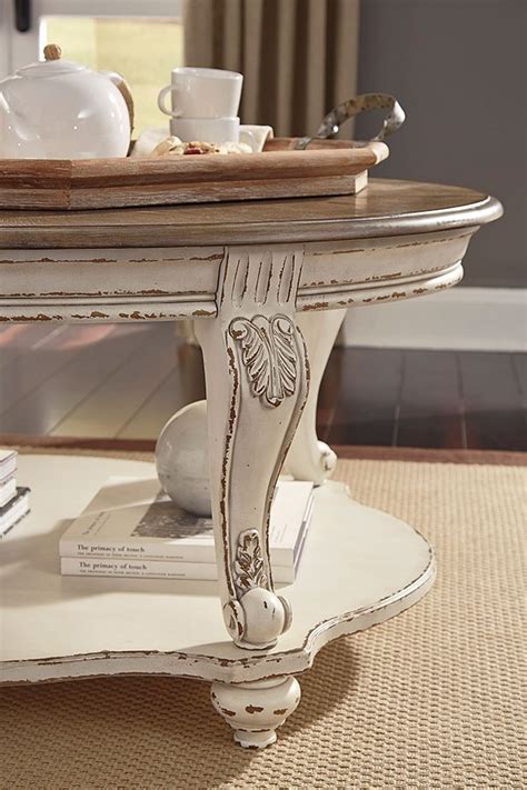 Explore unique fine art, craft & design for your home and wardrobe. Realyn Oval Cocktail Table by Signature Design by Ashley ...