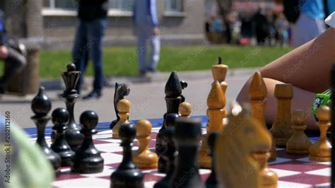 Chessboard And Figures Close Up Competitions In Checkers Among