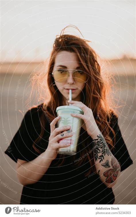 Long Haired Teenage Girl Drinking Milkshake A Royalty Free Stock