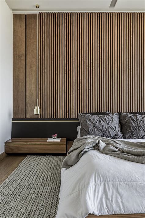 An Accent Wall Of Vertical Wood Helps To Accentuate The Feeling Of